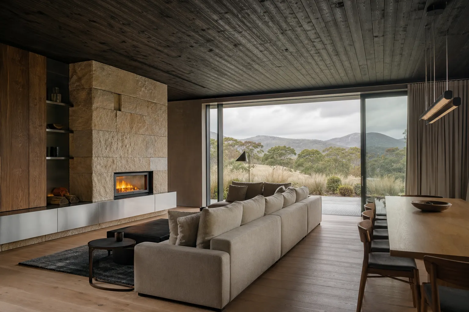 Warm timber and limestone living room opening to the landscape